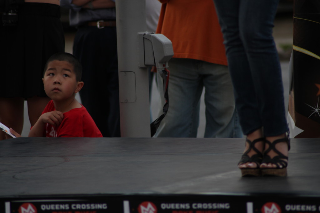 A young child watches the TVB USA Supernova Chinese-American singing competition in Flushing. New York, NY. 7:50 PM EST, Friday, June 21, 2013.